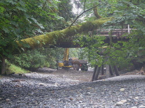 Rosewall Creek Restoration -bridge in fg, machines in bg.